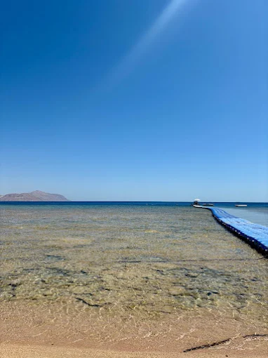 Clear water and beach jetty at Sinbad Beach